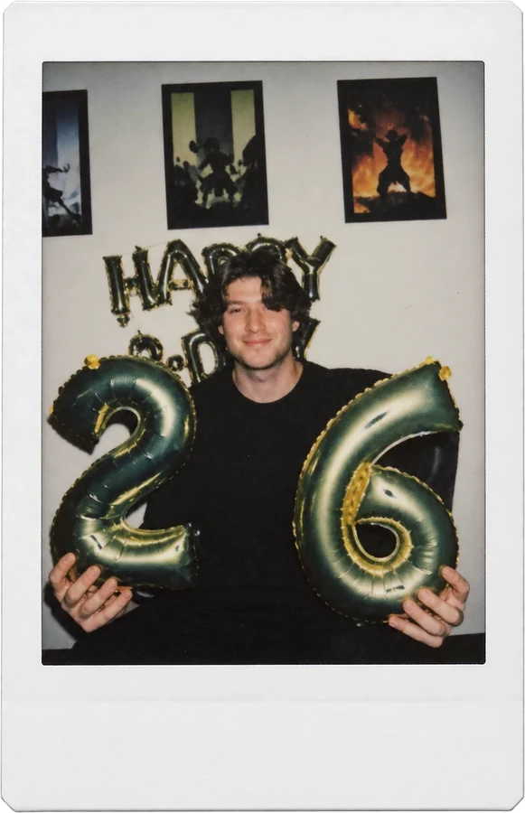 A birthday at the office, holding 2 and 6 balloons